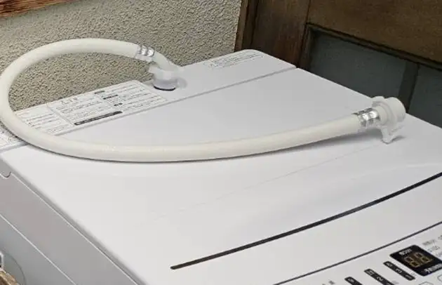 東近江市蒲生の洗濯機給水ホースの亀裂による水漏れ施工事例写真